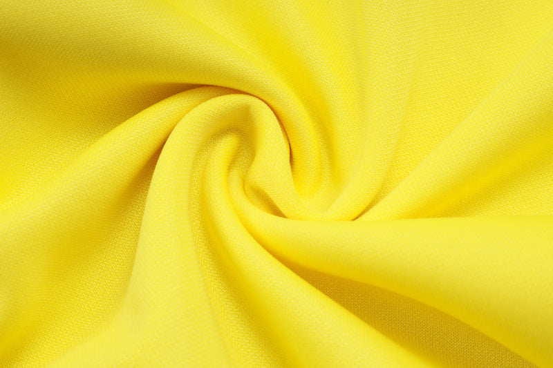 25-26 Real Madrid conjunto de chándal amarillo/negro niño